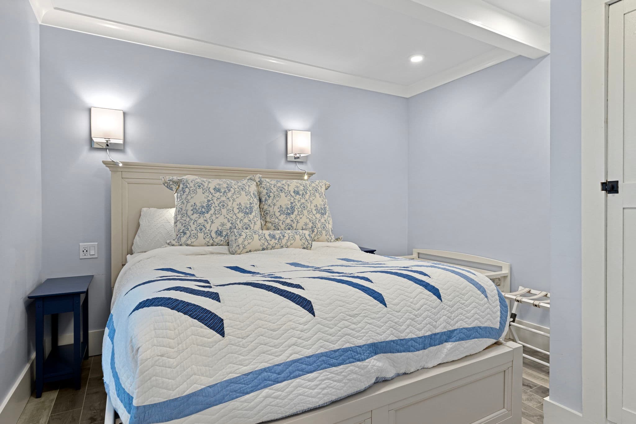 Queen Bedroom has sconce lighting and bedside USB outlet